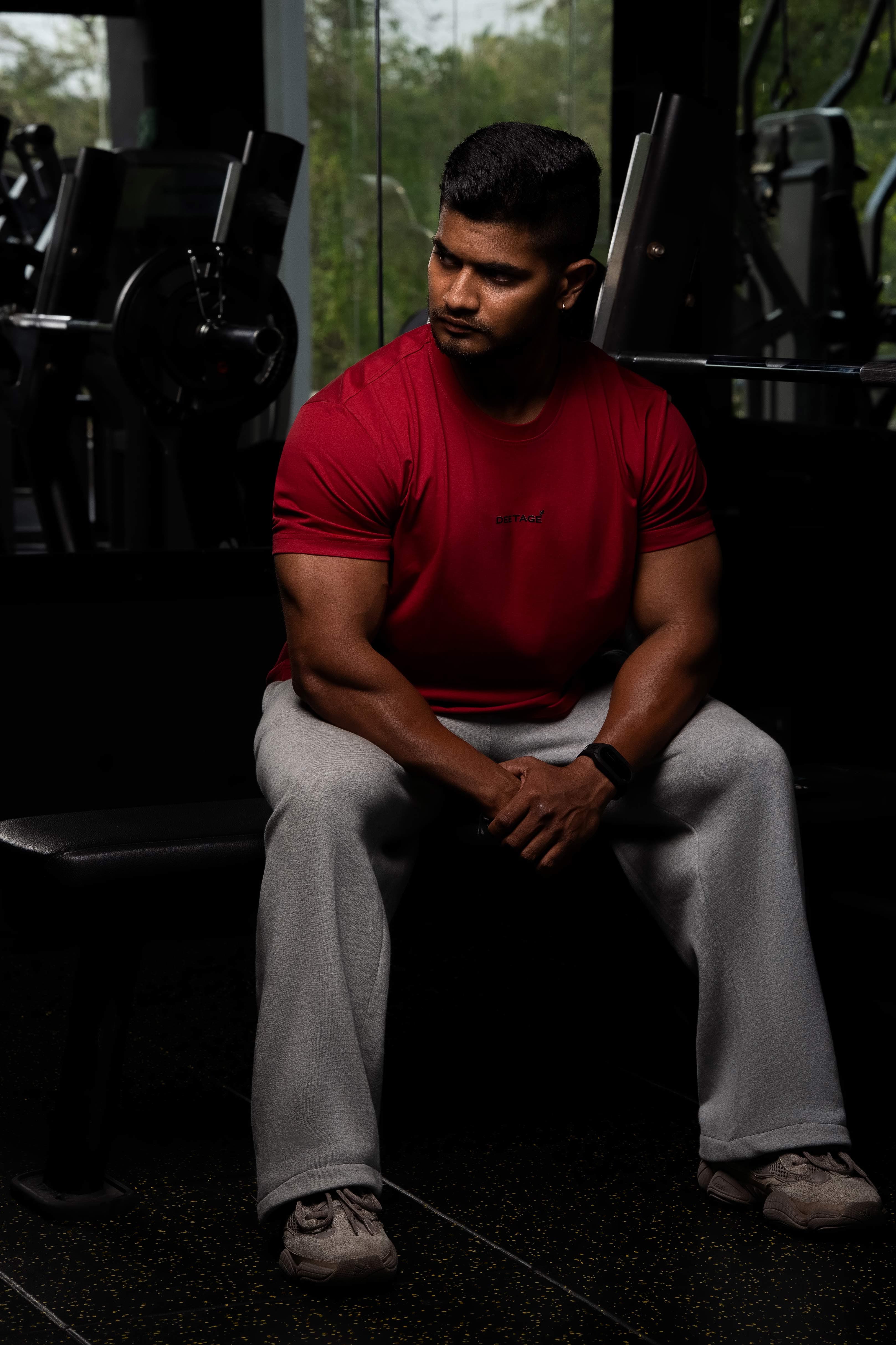 Muscular athlete in dark gym